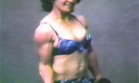 Classic converted super 8mm footage of Lois pinning a full-grown man then flexing her impressive (for the 1960's) biceps. Sheila lifts weights and flexes while having biceps measured.